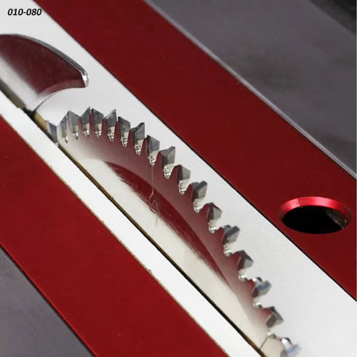 Close-up of precision carbide table saw blade in red saw insert for woodworking