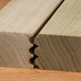Close-up of wood boards with a multi-bead router joint for precise woodworking joinery