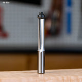 Straight router bit with bearing for woodworking on a workbench