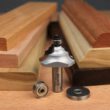 Woodworking router bit with bearings surrounded by molded wood trim pieces