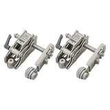 Pair of metal woodworking hold down clamps with adjustable levers and rollers on white background