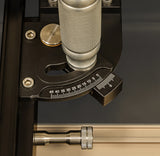 Precision woodworking tool with angle adjustment dial and metal handle, close-up