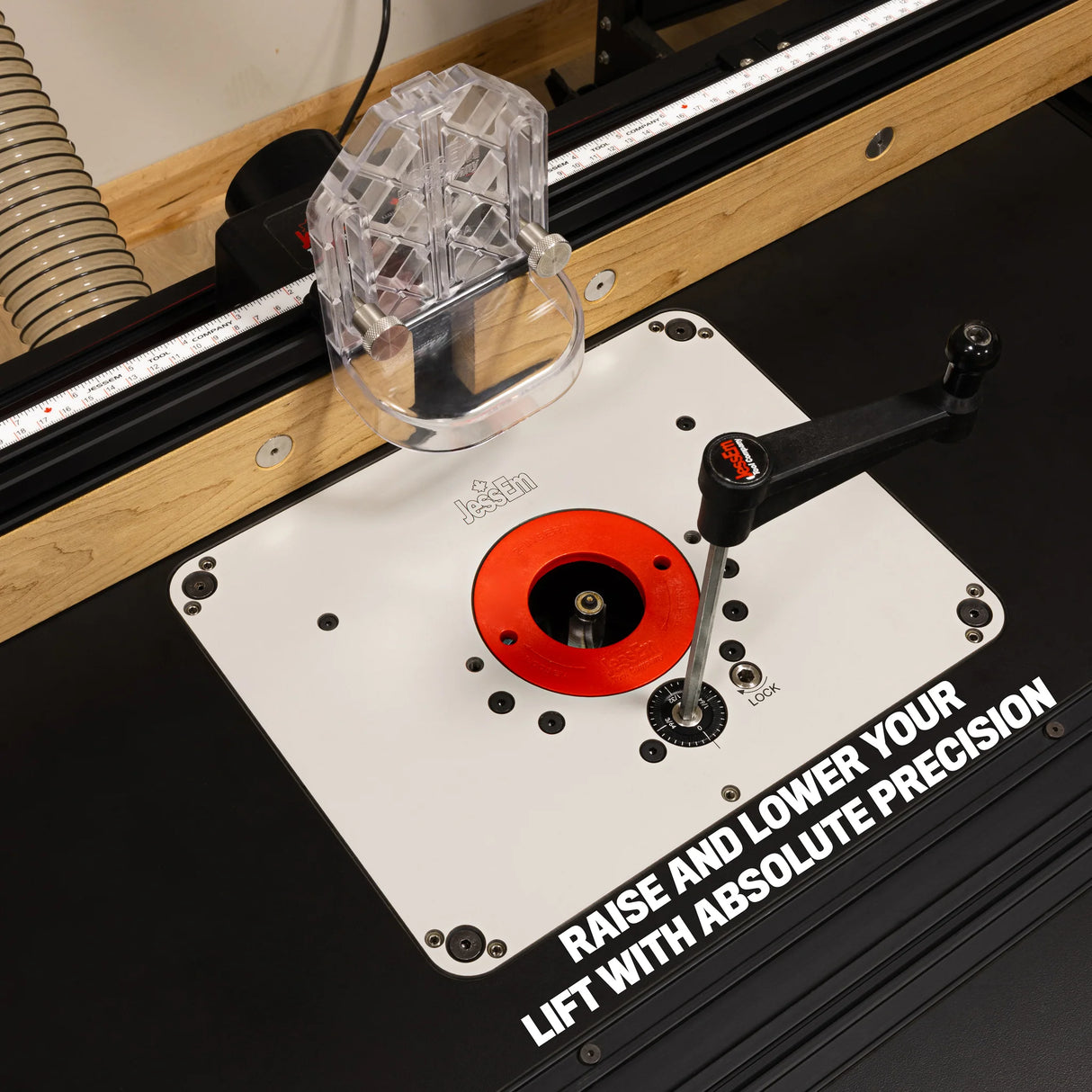 Router table lift system with red insert and adjustment handle for precise woodworking.