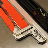 Table saw blade with precision measuring jig on metal surface for woodworking accuracy