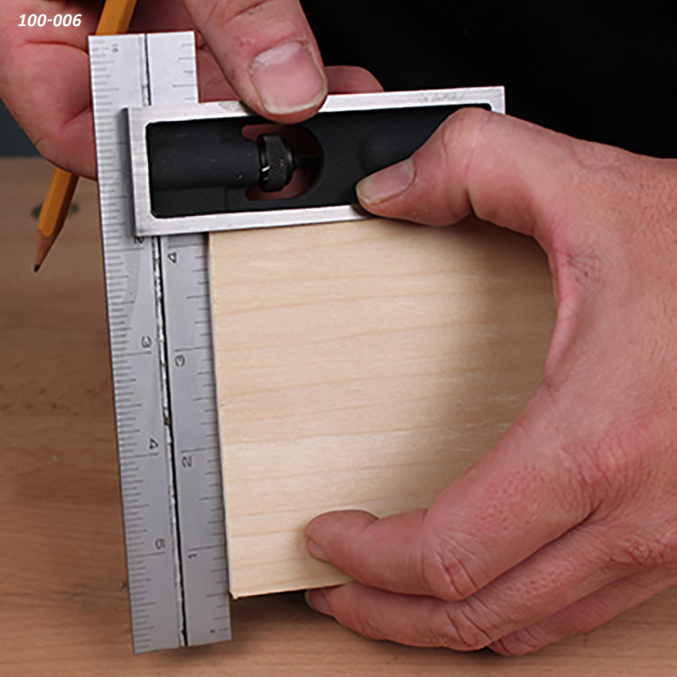 Combination square measuring wood for precise woodworking cuts