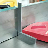 Precision machinist square checking table saw blade alignment in woodworking shop