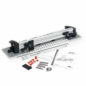 Woodworking dovetail jig kit with metal guide, clamps, instructions, and accessories
