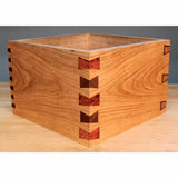 Wooden box with decorative dovetail and butterfly joints, woodworking joinery example