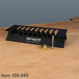 Woodworking dovetail jig, router bit, and guide bushing on a workbench
