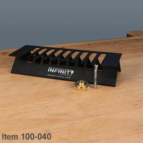 Woodworking dovetail jig, router bit, and guide bushing on a workbench