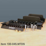 Woodworking dovetail jig set with router bits and bushings on a workbench