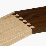 Maple and walnut wood joined with precision dovetail joint, close-up woodworking detail