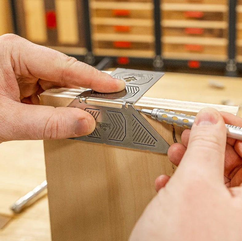 Woodworker using precision marking tool to measure and mark on woodworking project