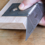 Precision woodworking angle guide checking mitered wood joint for accuracy on workbench