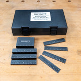 Infinity Tools precision setup blocks and their case arranged on a workbench