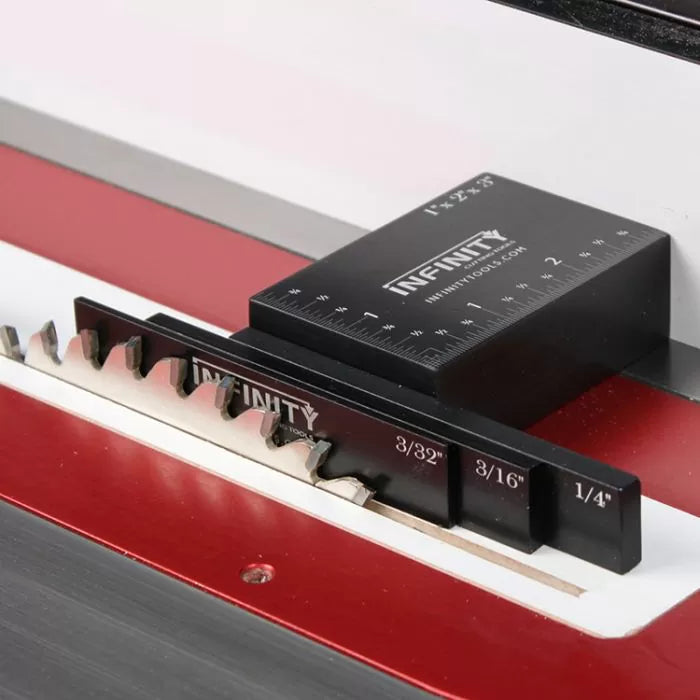 Table saw blade height gauge and setup block measuring saw blade teeth on red table