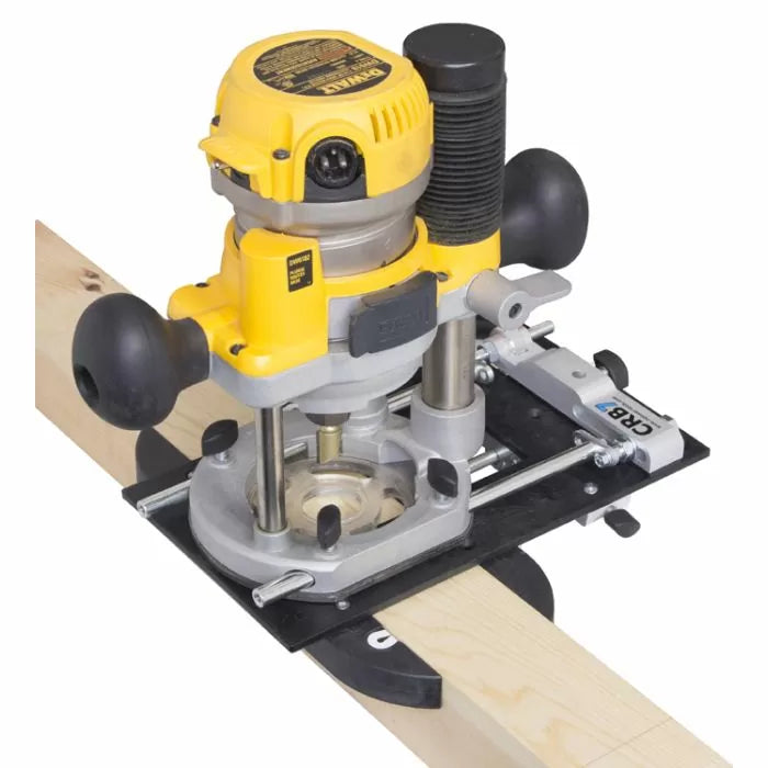 Woodworking router with guide jig attached to a board for precise cutting