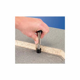 Hand using a woodworking laminate trimming tool on a countertop edge