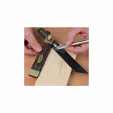 Woodworker marking wood with a sliding bevel gauge and precision marking knife