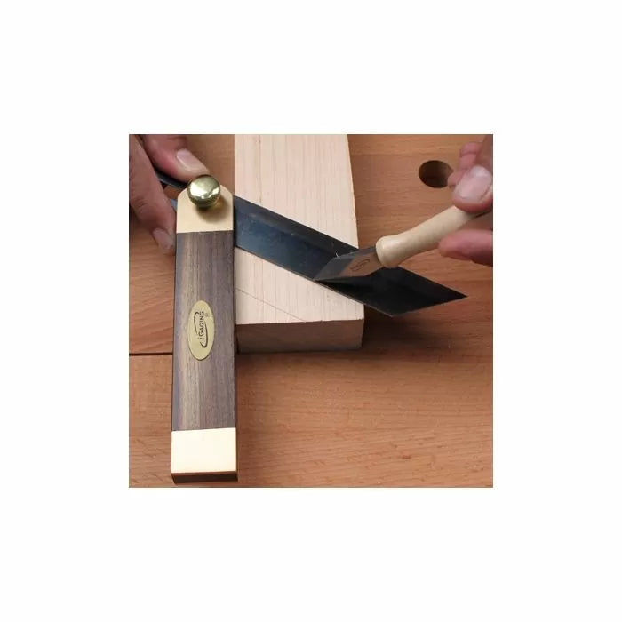 Marking gauge and carving knife used to mark precise angles on a woodworking piece