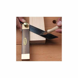 Marking gauge and carving knife used to mark precise angles on a woodworking piece