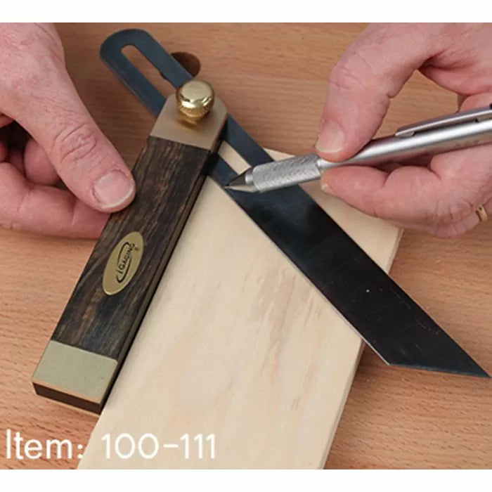 Woodworker using a bevel gauge and marking knife to measure angles on a wooden board