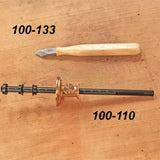 Woodworking marking knife and adjustable marking gauge on wooden surface