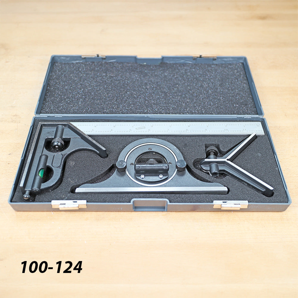Precision woodworking combination square set in foam-lined case on workbench
