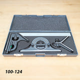 Precision woodworking combination square set in foam-lined case on workbench