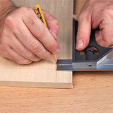 Marking a straight line on wood with a pencil and combination square for woodworking