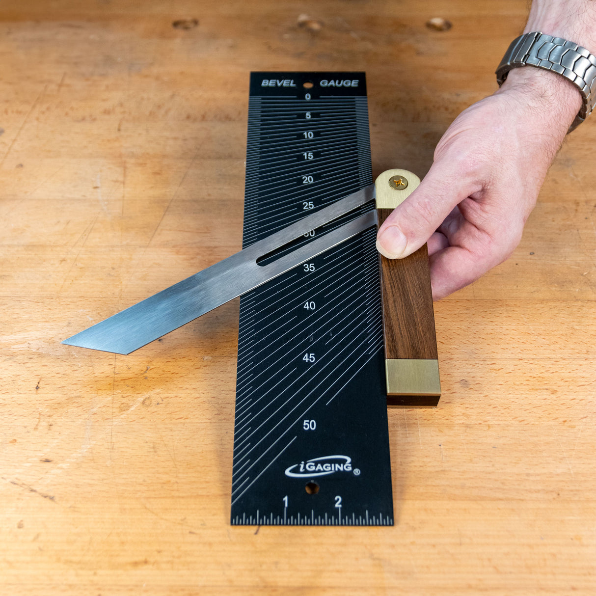 Bevel and center finding gauge used on wood bench for precise angle measurement in woodworking