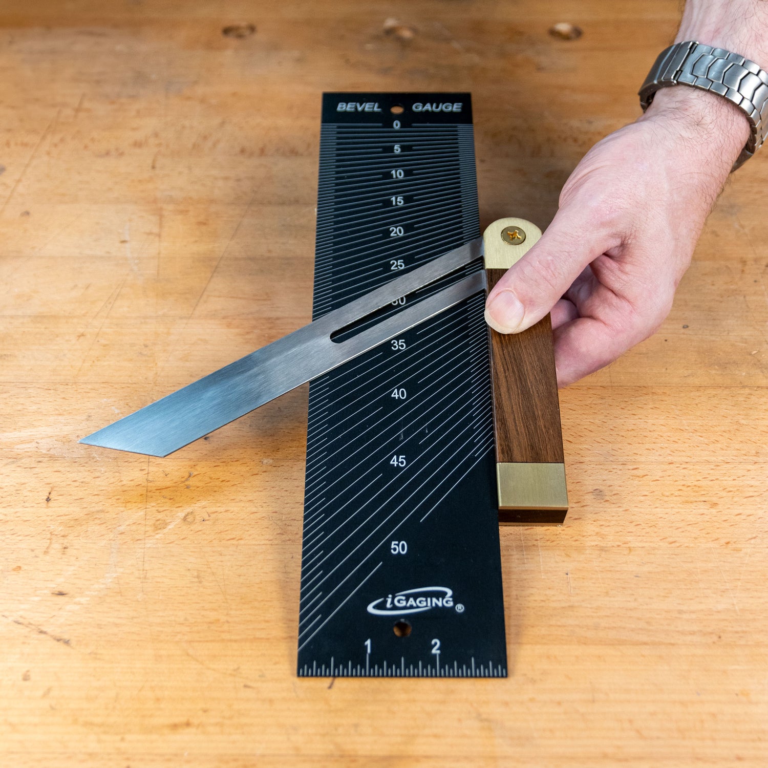 Bevel and center finding gauge used on wood bench for precise angle measurement in woodworking