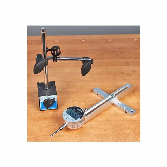 Digital indicator gauge and magnetic base on a wooden workbench for woodworking precision