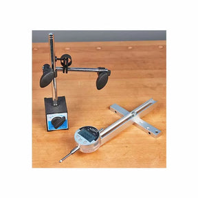 Digital indicator gauge and magnetic base on a wooden workbench for woodworking precision