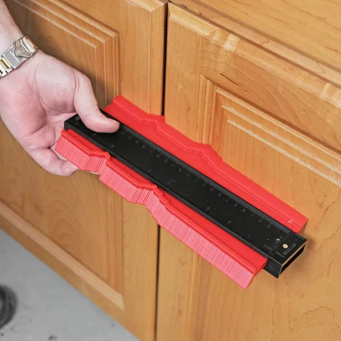 Contour gauge profile tool measuring cabinet edge for precise woodworking cuts