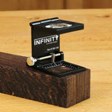 Magnifying edge gauge tool measuring wood grain on a workbench, woodworking precision tool