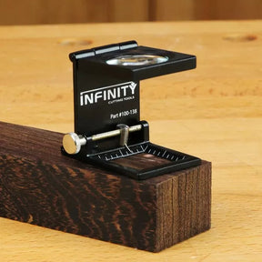 Magnifying edge gauge tool measuring wood grain on a workbench, woodworking precision tool