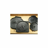 Set of four black router bit storage trays on a wooden workbench for woodworking tools