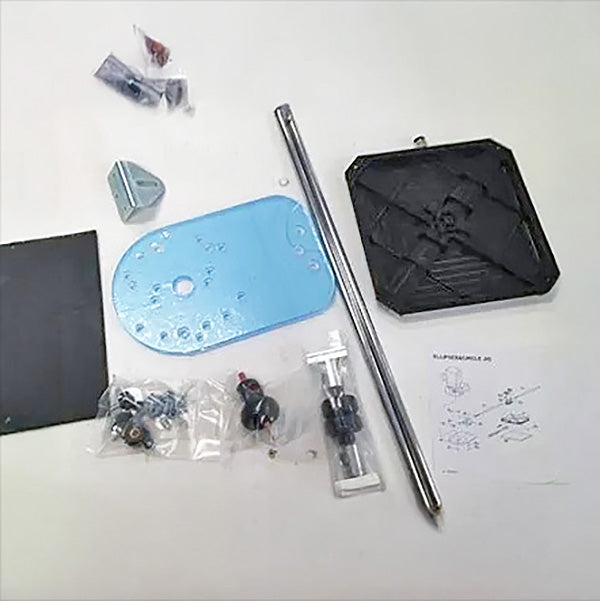 Woodworking router table jig kit components and accessories laid out on white surface.