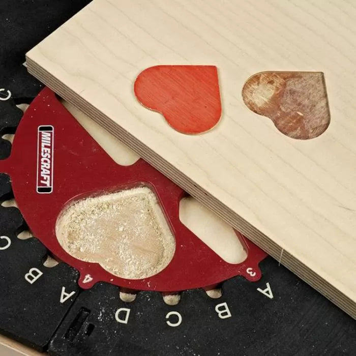 Woodworking heart cutouts on plywood using a router table and template guide