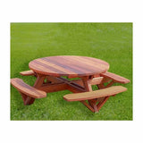 Round wooden picnic table with attached benches on green grass outdoor setting