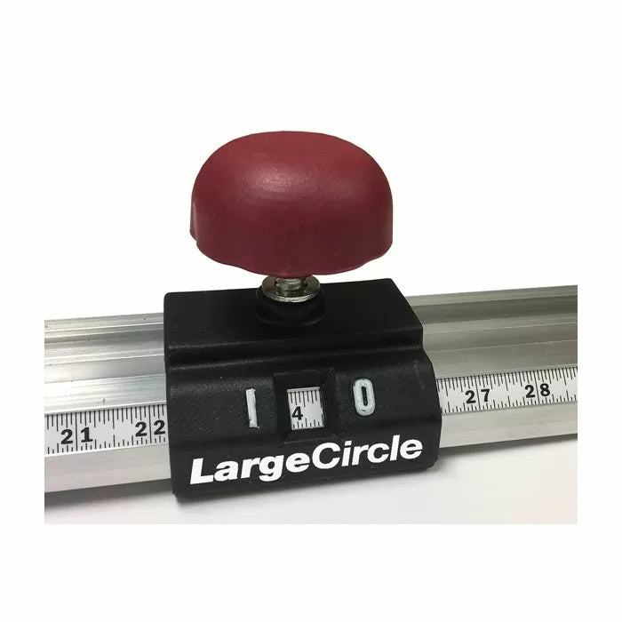 Router circle cutting jig with red knob and ruler for woodworking precision