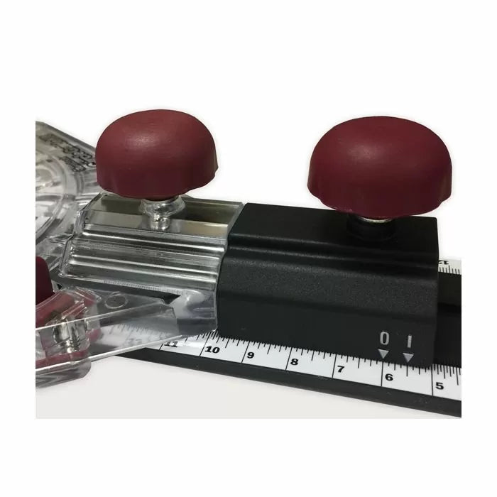 Woodworking jig with red handles and measurement guide for precise cutting tasks