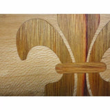 Close-up of a fleur-de-lis wood inlay pattern highlighting precise woodworking detail