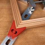 Picture frame clamping jig securing wooden mitered corners on a workbench