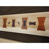 Wood board with inlaid butterfly key joints in various shapes and exotic wood colors, woodworking detail