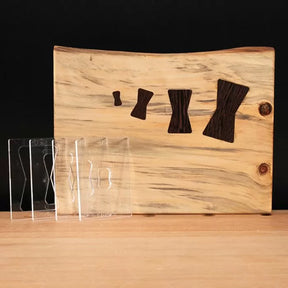 Set of clear woodworking bow tie inlay templates displayed with a wood board featuring bow tie inlays.