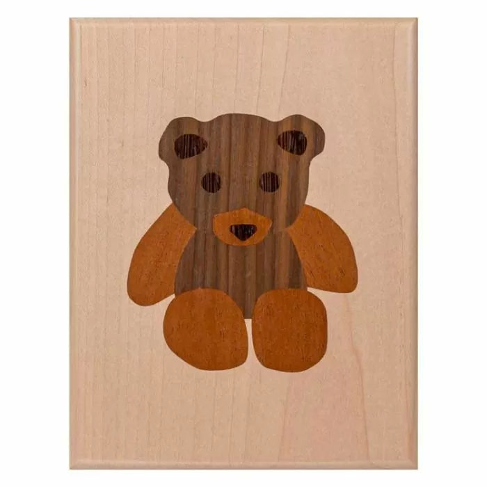 Wood inlay plaque featuring a teddy bear design, ideal for woodworking projects and decor.