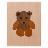 Wood inlay plaque featuring a teddy bear design, ideal for woodworking projects and decor.