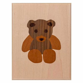 Wood inlay plaque featuring a teddy bear design, ideal for woodworking projects and decor.